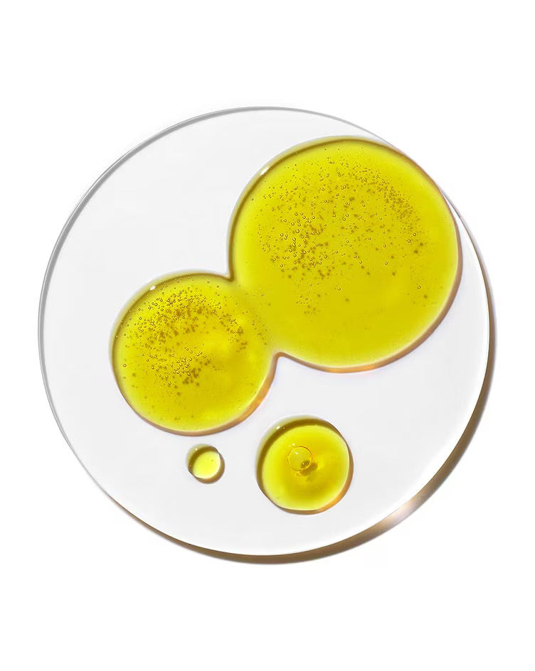 yellow liquid on glass sheet